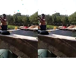 A hot sesexy video of a girl taking a bath in a river.