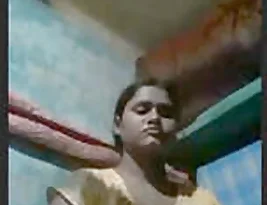 A young Indian woman from a small village exposes her breasts and private parts.