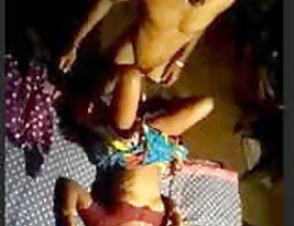 A married couple from a small village having sex at night.