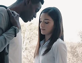 Emily Willis, the young beauty, has sex with a black man while riding him reverse cowgirl style.