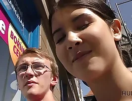 A brunette gets an explanation about a debt she did not know about from a nerdy man.