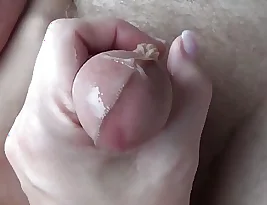 See how an arm is used to give a footjob while wearing nylon socks