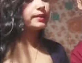 A sexy Indian woman performs alongside her husband in a live show.