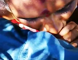 Young Indian countryside woman gives blow job outdoors