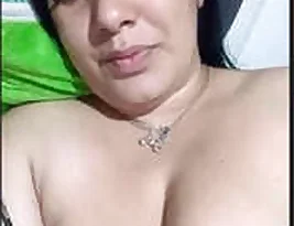 Beautiful wife of a family friend exposes her breasts and vagina.