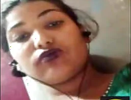 Finger and mouth to enable pleasure in an horny Indian woman via video call.