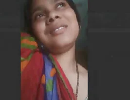 Steamy scene of the Bhabhi masturbating on the phone.