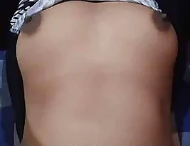 An Indian girl plays with her breasts.