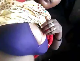 Aldeia boudi exposing her breasts and private parts.