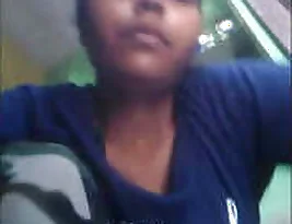 A hot rural Indian woman urinates outside.