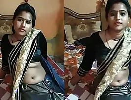 Pretty Indian girl likes to have her navel kissed and rubbed.