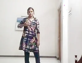 A teenage Indian girl undresses to show her body.