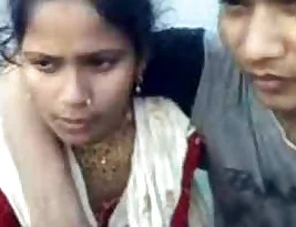 College guys flirt with shy Indian girl in front of her house.