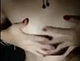 A girl strips, and exposes her breasts, and uses her hands to cover them.
