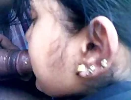 A beautiful Indian woman giving a blow job in a car