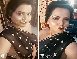 Beautiful Indian woman wears a sari and reveals her beautiful big boobs.