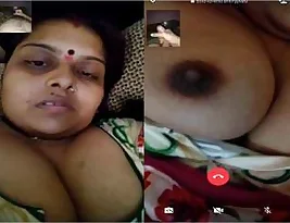 Hot Indian housewife exposes her big breasts during a video call to her lover.