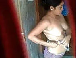 Hidden camera in the bathroom with a Desi Indian girl - 2 videos available.
