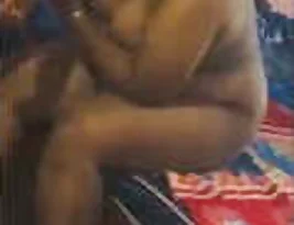 A Tamil woman seduces her husband at home.
