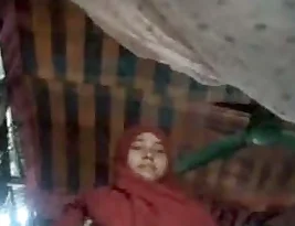 Young Muslim woman exposes her large breasts and genitals.