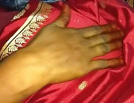 Beautiful horny housewife from India in red saree in a hot scene.